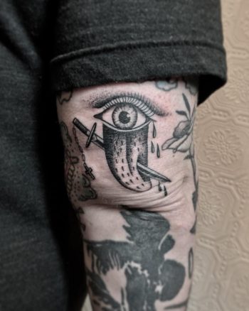 Sword pierced tongue tattoo by @justinoliviertattoo