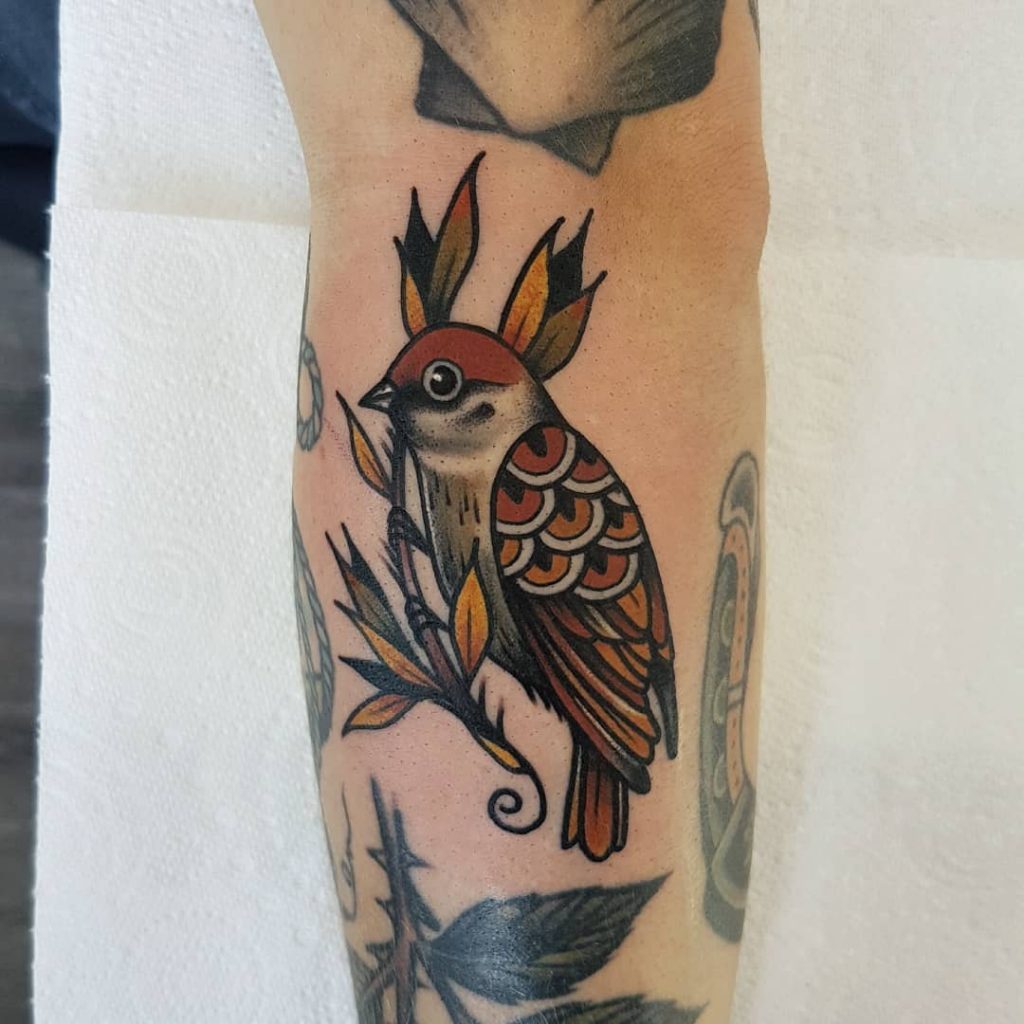 Northern cardinal sitting on a branch tattoo - Tattoogrid.net