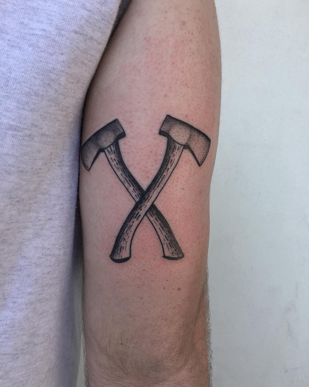 Two axes by @justinoliviertattoo