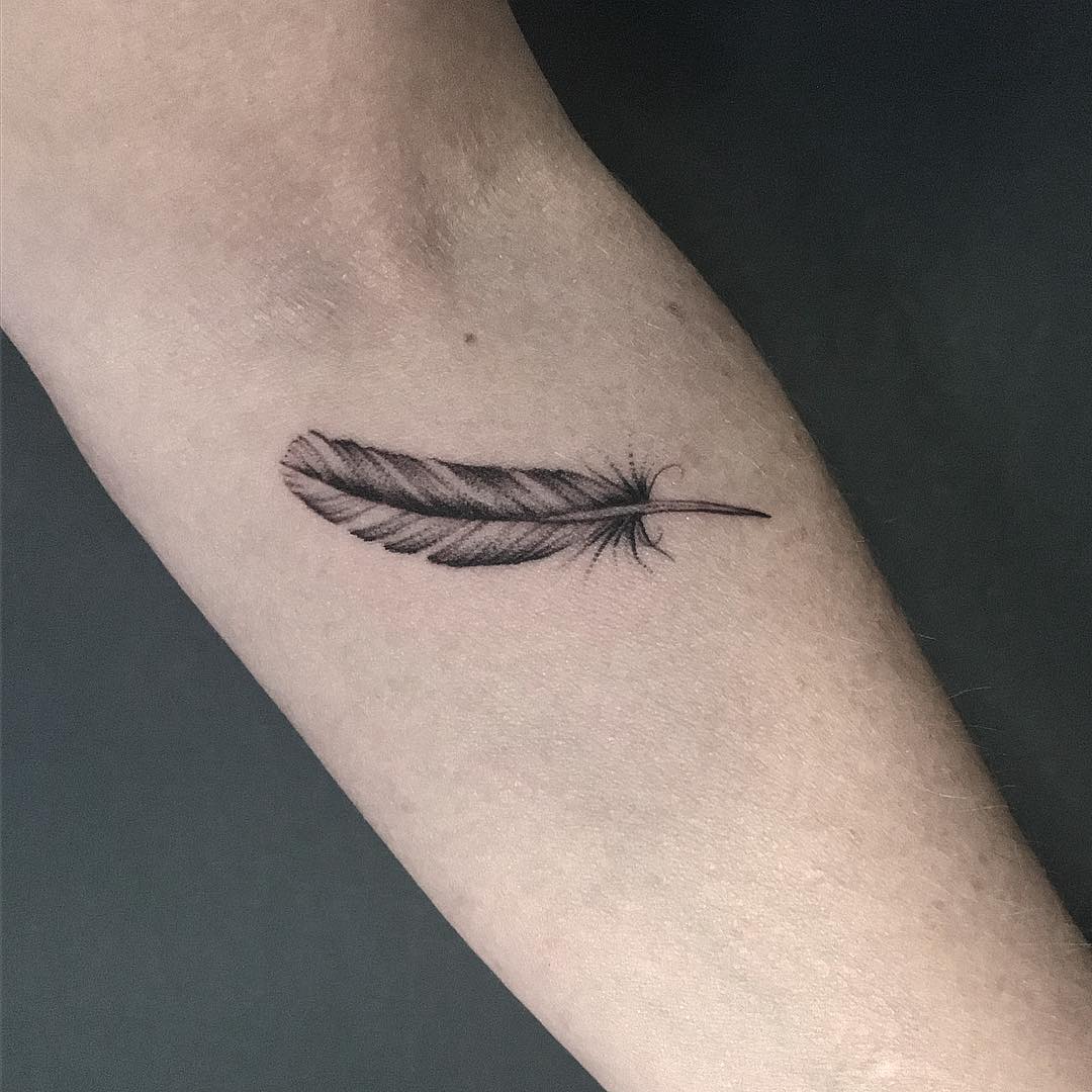 Feather by @rebecca_vincent_tattoo