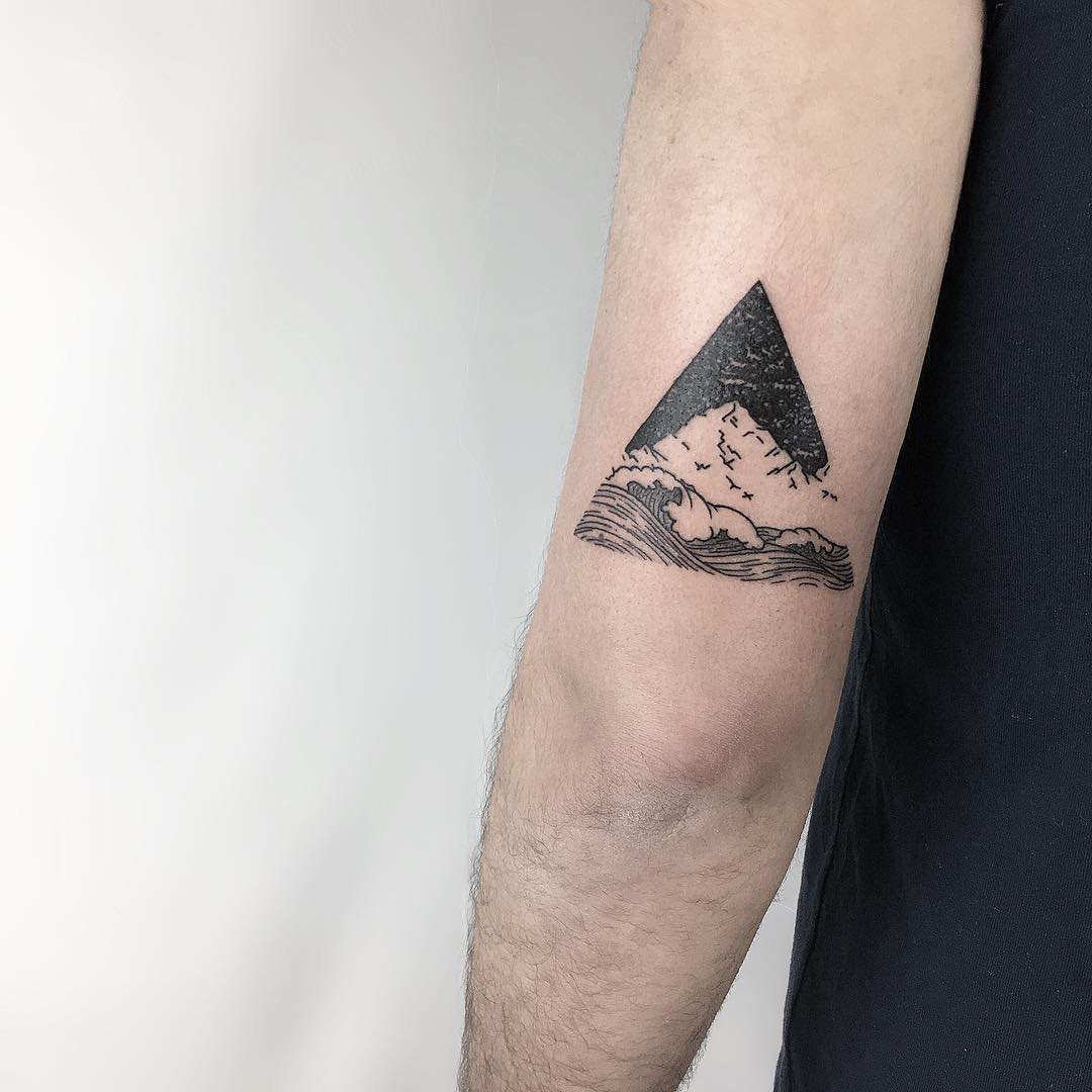 Mountain and waves by @isaarttattoo 