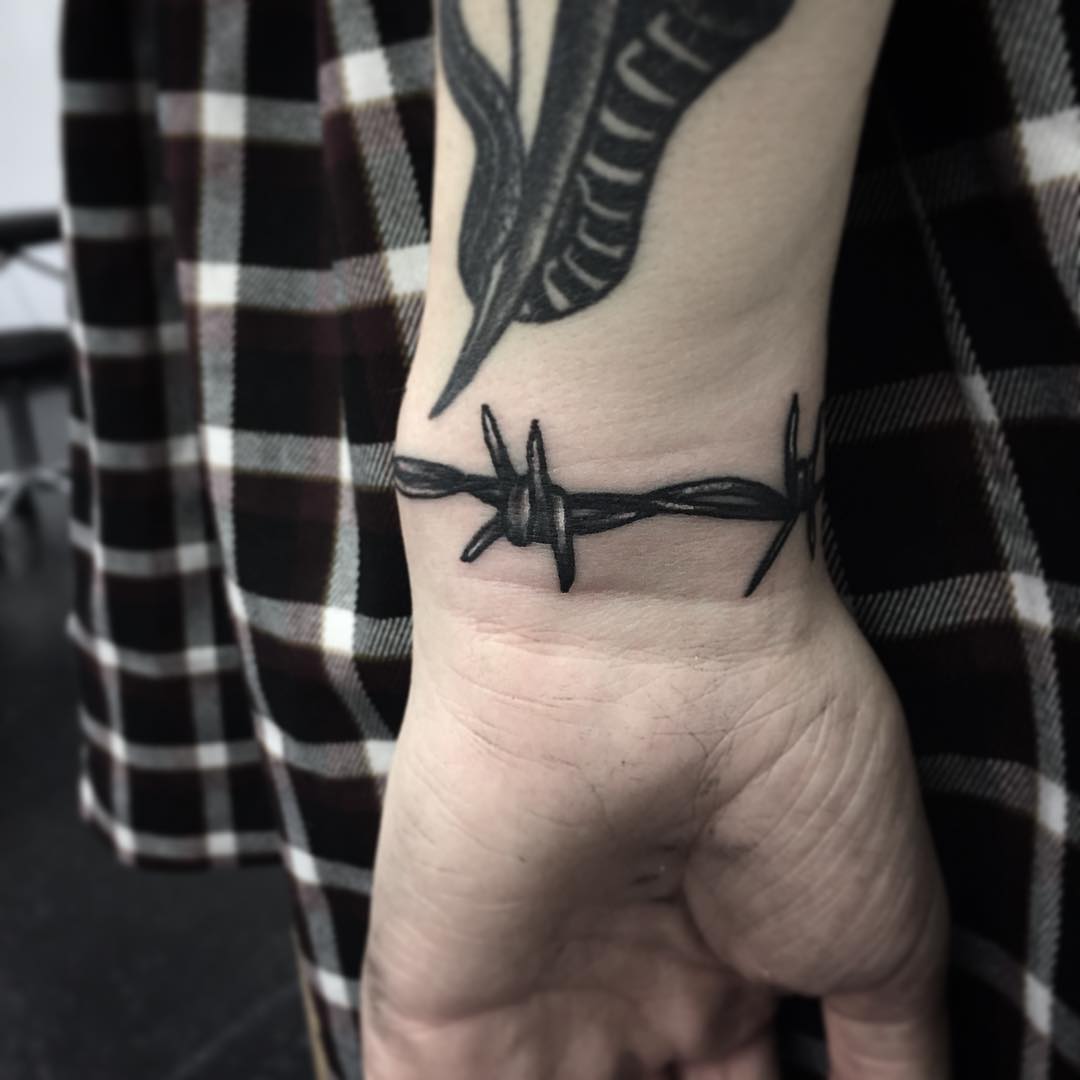 Barbed wire band by @rebecca_vincent_tattoo
