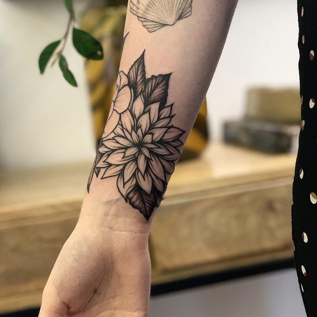 Dahlia on a wrist by @rebecca_vincent_tattoo