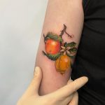 Citrus garden tattoo by tattooist Anna Zelenska