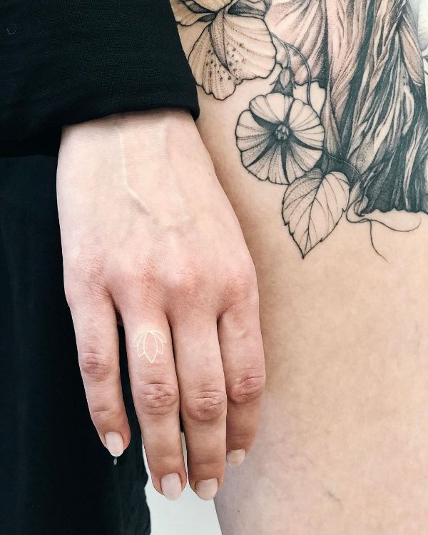 Tiny White Lotus Tattoo by @vlada.2wnt2