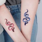 Matching Snake Tattoos by @e.nal.tattoo