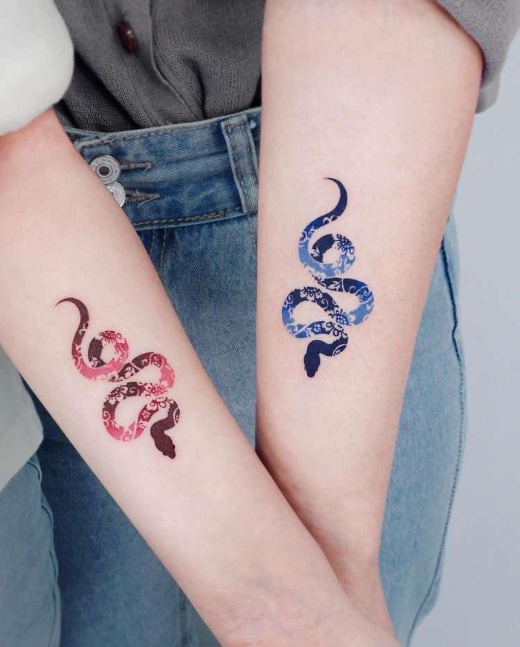 Matching Snake Tattoos by @e.nal.tattoo