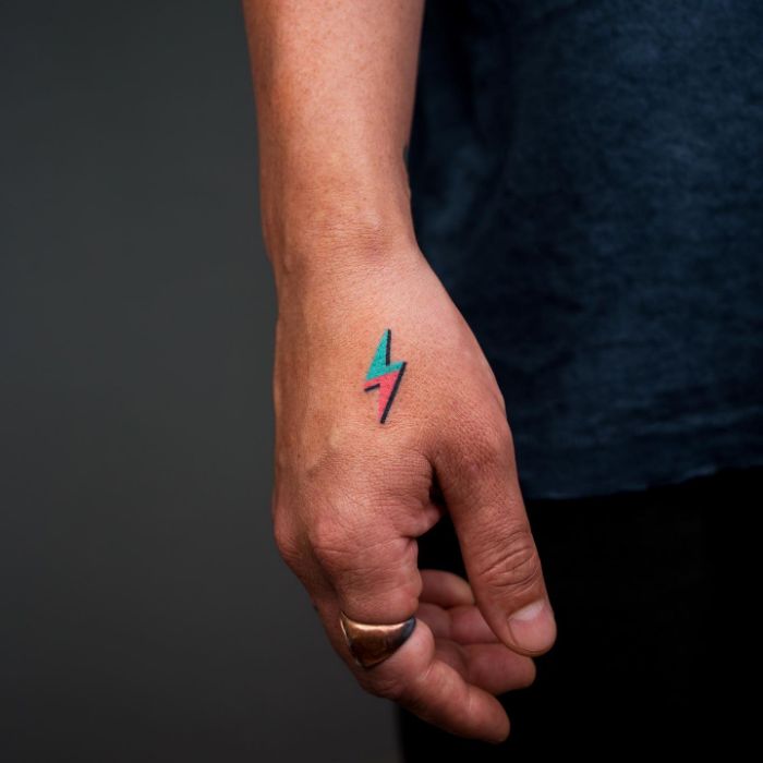 Hand-poked Tiny Lightning Bolt Tattoo by @zzizziboy