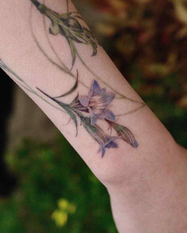 Realistic Purple Flower Tattoo by @comotattoo