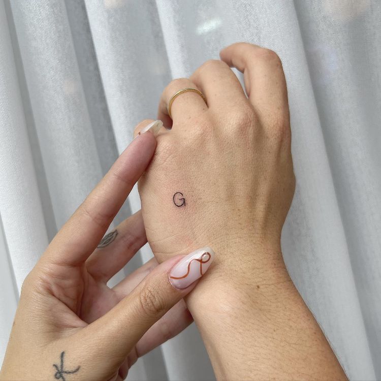 Tiny Letter G Tattoo by @sarakori