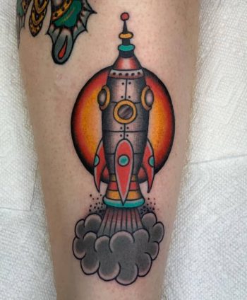 Rocketship tattoo by @alexduquettetattoos