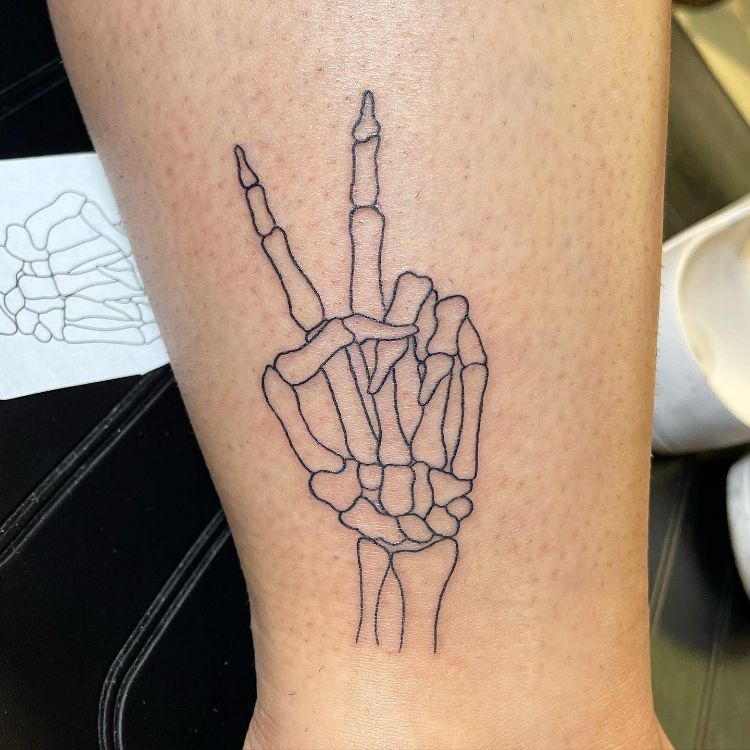 Skeleton Hand Peace Sign Tattoo by @bethanymorgan_tattoos