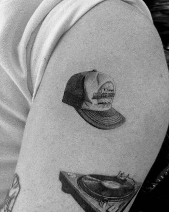 Grandfathers Cap Tattoo by @ola.tattoo