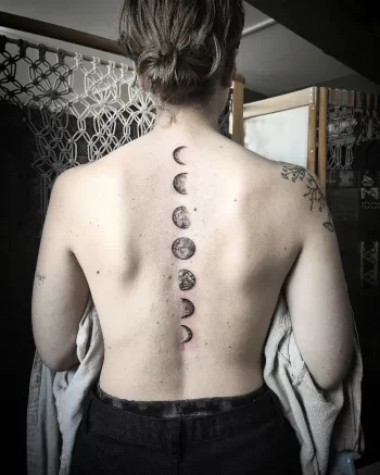 Moon Phase Spine Tattoo by @mkeltattoo