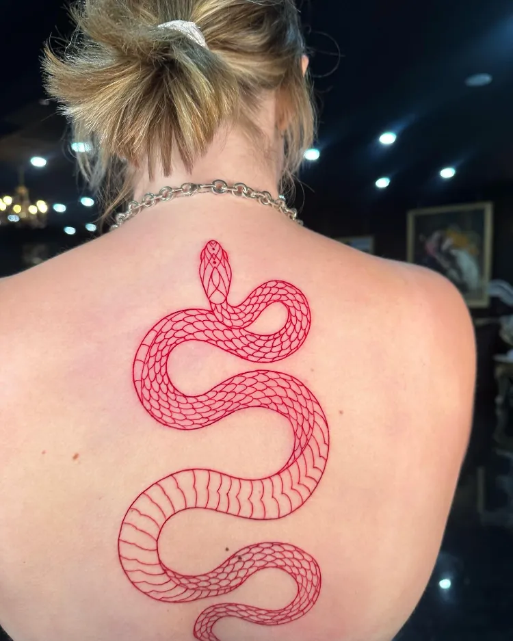 Snake tattoo on spine by @yokainani